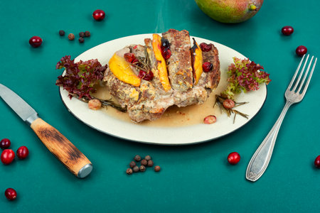 Homemade pork roll baked with aromatic mango pieces. Food recipe.の写真素材