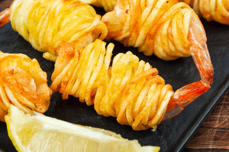 Fried rolled potato shrimps, prawns and potato rolls. Popular Asian food. Vietnamese cuisine.の写真素材
