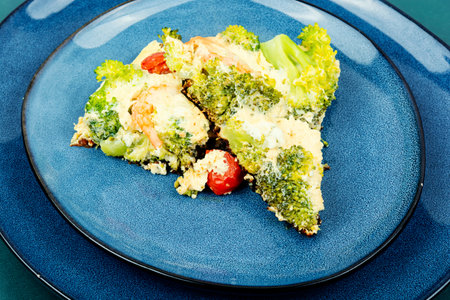 Tasty egg omelette with with broccoli, shrimp and tomato. Ketogenic lunch.の写真素材