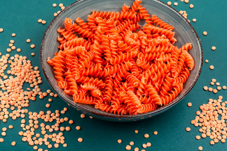 Dry red lentil fusilli pasta. Uncooked vegan pasta. Raw and dry macaroni.の写真素材