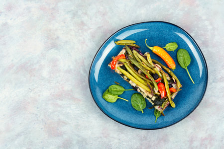 Vegetable tart with green or bush beans and peppers. Vegetarian vegetable pie. Space for text,...