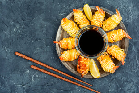 Fried rolled potato shrimps, prawns and potato rolls. Popular Asian food. Vietnamese cuisine. Space for text.の写真素材
