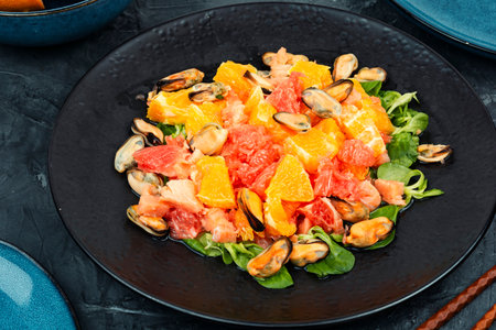 Salad with citrus fruits and mussels, dieting eating. Healthy food concept.の写真素材