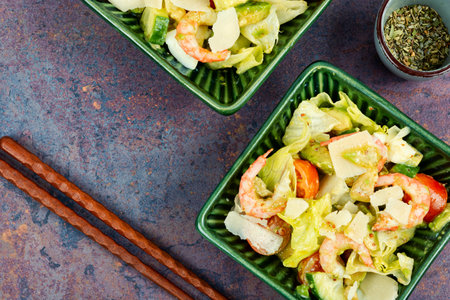 Asian salad with shrimps ,prawns avocado slices and tomato. Top view.の写真素材