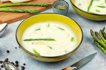 Dietary cream soup with white and green asparagus in bowl. Detox food.の写真素材