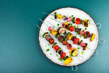 Grilled vegetable skewers with cherry tomatoes, radishes, peppers and onions. Vegetable kebab. Flat lay, copy space for text.の写真素材