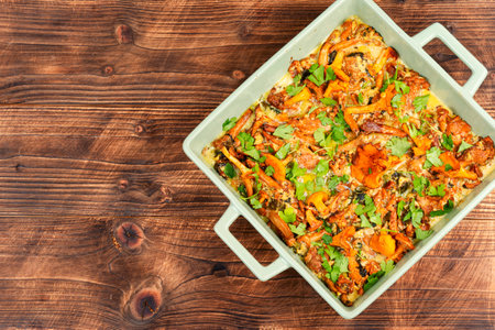 Appetizing vegetable frittata with chanterelles. Space for text.の写真素材