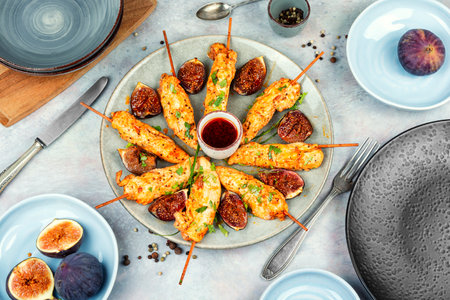 Grilled chicken satay skewers with fig sauce. Flat lay.の写真素材
