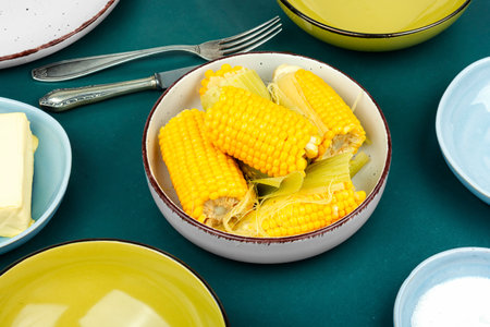 Homemade golden sweet corn cob or maize with butter and salt