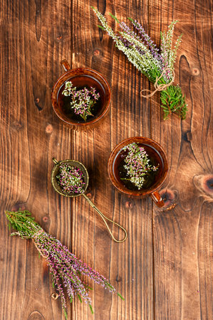 Natural herbal tea made from fresh heather on wooden table. Healthy drink. Rustic style.の写真素材