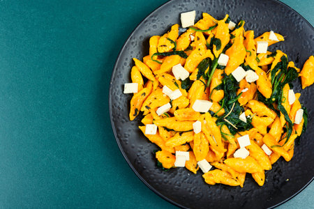 Vegan snack, pumpkin in dough, pumpkin paste or dumplings. Autumn meal. Copy space.