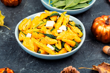 Delicious pumpkin gnocchi with herbs, vegan food.の写真素材