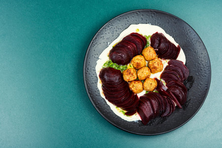 Delicious diet falafel on a plate with beetroot, vegan salad. Copy space.の写真素材