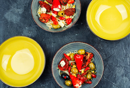 Pickled soya bean salad with pickled soybean sprouts, dried tomatoes, olives and peppers. Korean Food. Top view.の写真素材