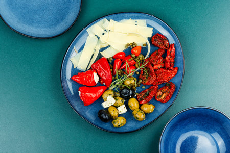 Mediterranean snack assortment. Assortment of antipasti on a plate. Flat lay