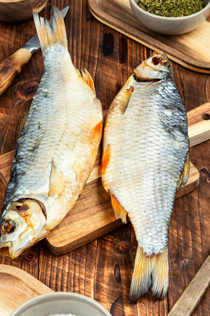 Dried roach fish. Salty dry river fish on a table.