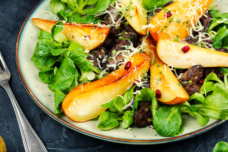 Plate of chicken liver salad with caramelized pear.の写真素材