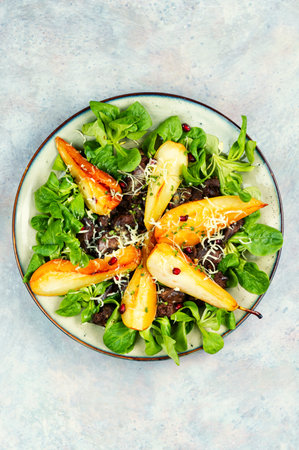 Chicken salad of caramelized pear, chicken liver and fresh lettuce.の写真素材