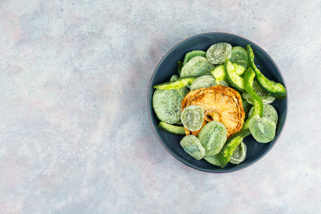Candied tropical fruits dried candied fruits. Kiwi, mango and pineapple rings. Organic food. Space for text.の写真素材