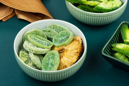 Delicious homemade candied fruits. Healthy snack, vegetarian sweets. Candied mango,kiwi and pineapple rings.の写真素材