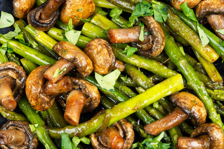 Organic green asparagus fried with mushrooms and greens. Food backgroundの写真素材