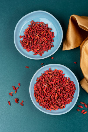 Dried Goji Berries in Bowl, Healthy Food, Superfood. Top view.