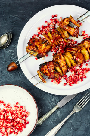 Grilled chicken meat, roasted skewers with chicken wings and potatoes. Top viewの写真素材