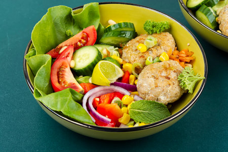 Healthy Homemade Vegetable Buddha Bowl with Fish Cutlets. Fish meatballs.