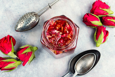 Flower jam, rose petal jam and tea. Breakfast with tea, and flowers jam. Flat lay.の写真素材