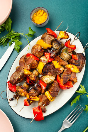 Delicious juicy skewers with pork meat grilling, grilled pork kebabs. Barbecued.の写真素材