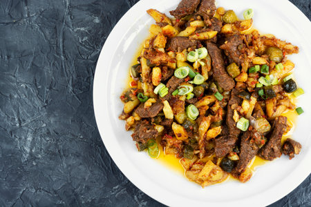 Azu is a classic dish of Tatar cuisine from stewed beef, pickles and potatoes. Stewed vegetables with meat. Copy space.の写真素材