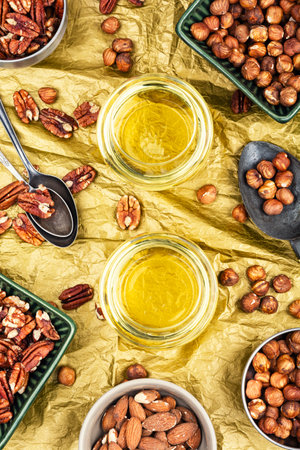 Healthy vegetable nuts oil bottle. Glass with nut oil.