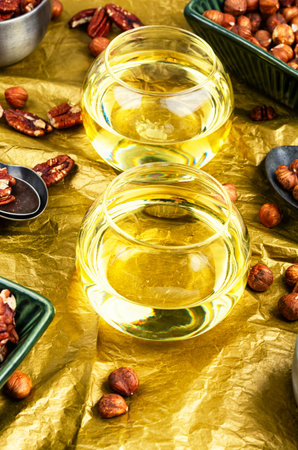 Glass jars with different kinds of nut oil.の写真素材