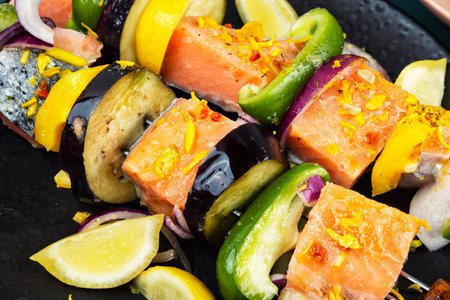 Fresh salmon marinated skewers are seasoned, preparing for a delicious grilling. Close up.の写真素材