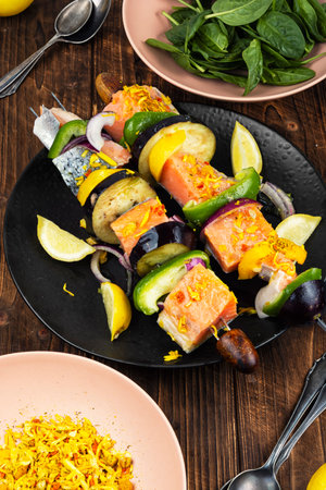 Fresh salmon marinated skewers are seasoned, preparing for a delicious grilling.の写真素材