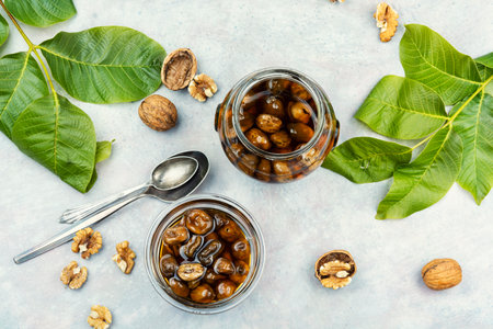 Jam from the fruit of a walnut, homemade jam with walnuts. Autumn conservation.の写真素材