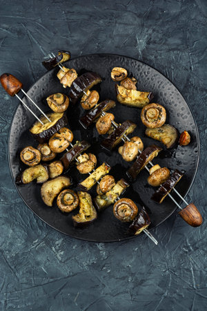 Delicious grilled vegetable skewers with eggplant and mushrooms.の写真素材
