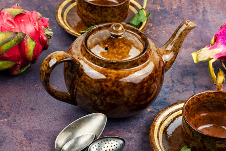 Teapot with aromatic mint tea with dragon fruit, breakfast with dragon fruit.の写真素材