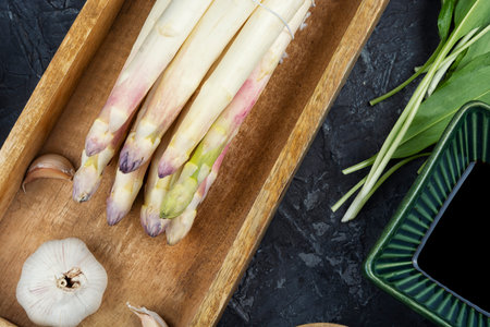 Pile of fresh raw asparagus, spring season, new white asparagus, bunch of raw white asparagus.の写真素材