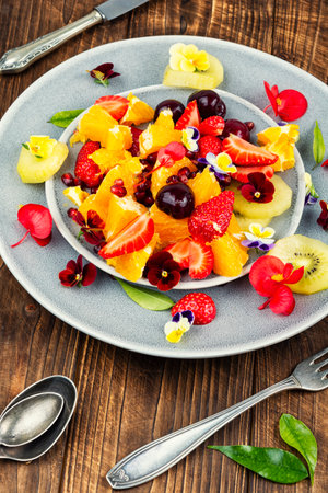 Summer salad of mixed fruits and flowers. Healthy food. Food photography.の写真素材