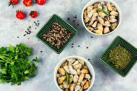 Raw fresh seafood with lemon, frozen mussels on a table.の写真素材