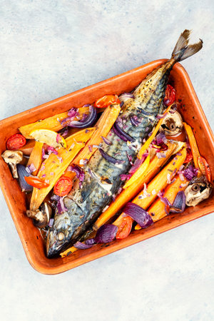 Fried mackerel fish with lemon, sweet potato fries and spices.の写真素材