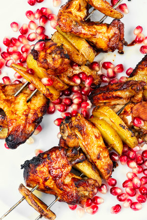 Grilled roasted chicken skewers with vegetables. Chicken kebab, meat on skewers.の写真素材