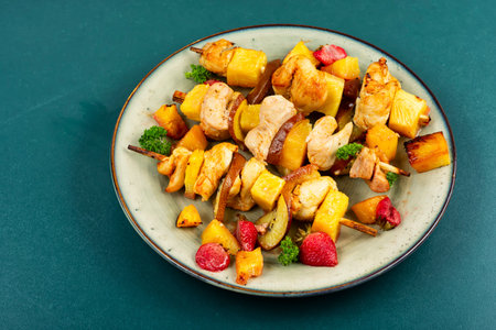 Delicious chicken kebab, grilled chicken meat in pineapple strawberry marinade.の写真素材