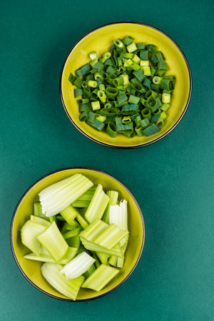 Freshly cut celery stalks ready to be enjoyed, vegan cuisine. Top view.の写真素材