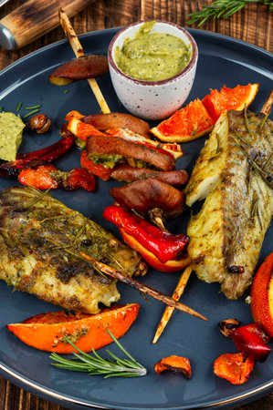 Delicious grilled fish steak. Pollock steaks baked on skewers. BBQの写真素材