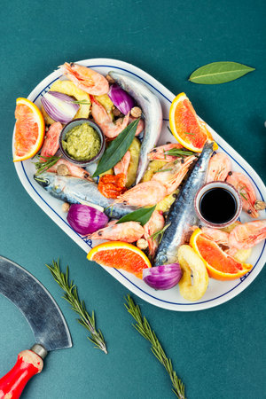 Fresh mixed seafood marinated in spices and citrus juice. Whole fish, shrimp, squid rings.の写真素材