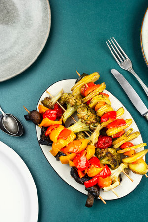 Barbecue grilled vegetable kebabs. Vegetable Kebab with Bell Pepper, Mushrooms, Tomato and Broccoli.の写真素材