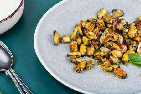 Delicious fried peeled mussels with figs, seafood, autumn recipe.の写真素材