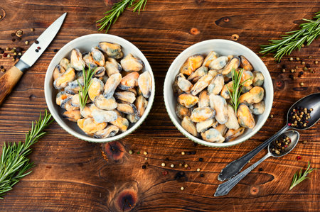 Fresh mussels seafood with ice in bowl. Platter of raw mussels.の写真素材